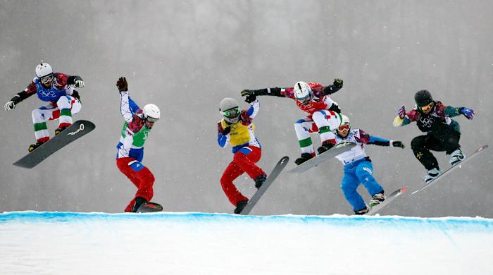 Pierre Vaultier races against competitors during the second heat of the semifinals in men's snowboard cross during the Sochi 2014 Olympic Winter Games at Rosa Khutor Extreme Park.